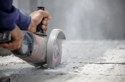 worker-using-tool-cut-concrete-floor